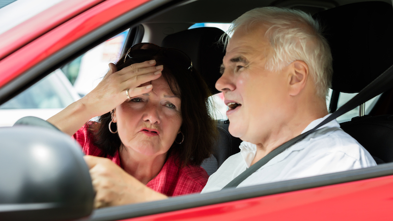 couple arguing in car. Photo by Andrey Popov, Dreamstime. A wife has developed Amaxophobia, a fear of riding in a vehicle, but her husband continues to be a reckless driver. What does Ask Amy advise? Image