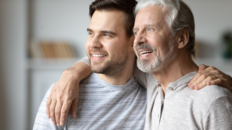 Father and adult son. Image by Fizkes, Dreamstime. Through DNA testing, Dad discovers his son is not his biological son. Mom refuses to discuss, even with the son. See what “Ask Amy” advises.