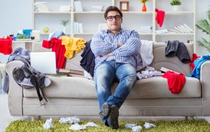 teenager in messy room. Photo by Elnur, Dreamstime. A mom is horrified at how messy her son’s dorm mates are. Parents need to teach an adulting checklist, she says! See what “Ask Amy” says. Image