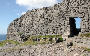 On the Aran Islands: At the prehistoric fortress of Dun Aengus, the dramatic west cliffs of Ireland meet the turbulent sea as Europe comes to an abrupt end. Image