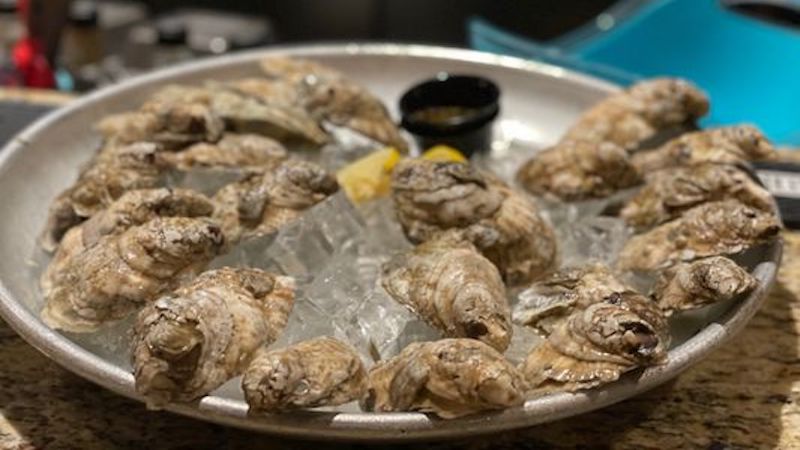 raw oysters on a platter. Richmond food and travel writer Steve Cook gives three reasons why Happy Hour at Latitude Seafood Co. will make you sing. Image