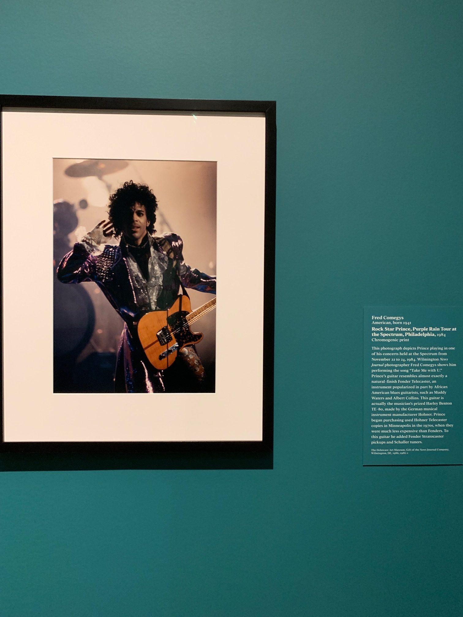 Fred Comegys chromogenic print, “Rock Star Prince, Purple Rain Tour at the Spectrum, Philadelphia,” 1984. At "Storied Strings," VMFA.