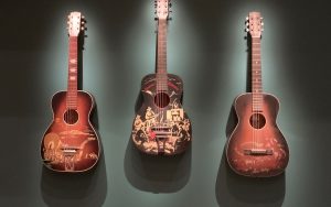 three cowboy guitars on display at the VMFA exhibition, 