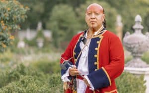 Nation Builder Oconostota behind the Governor's Palace, portrayed here by Kody Grant. For: Honor American Indian Heritage Month and imbibe history – and beer – and music. In this week’s What’s Booming RVA: Celebrations of History, Beer, and Music. Image