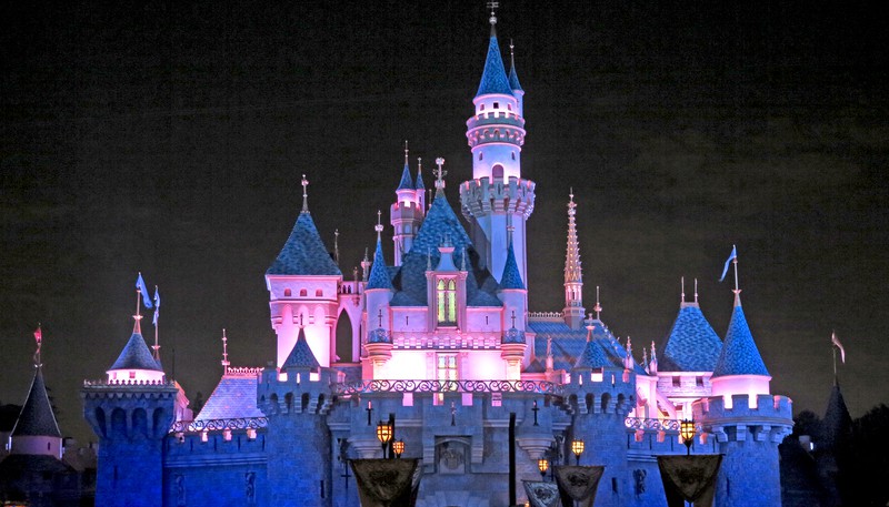 The Cinderella castle at Disneyland in California after dark. After a childhood of making Disney memories, R. G. Begora made his first visit to Disneyland at the age of 59, with unexpected results.