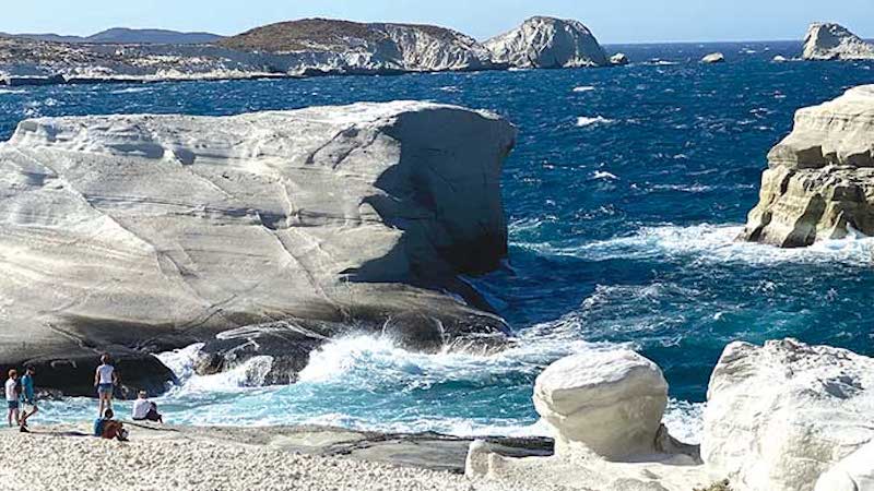 Sarakiniko Beach moonscape, Milos. The Idyllic Aegean cruise in the Greek islands includes a moon-like landscape, archeological wonders, adventure and fabulous food and wine.