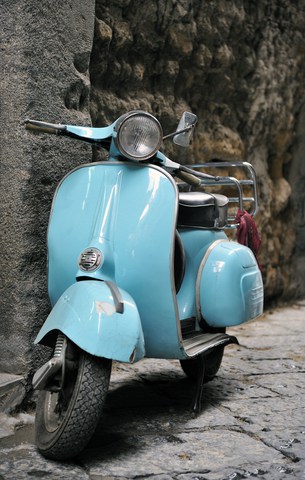 a classic blue Vespa, model uncertain. Image by Worldfoto