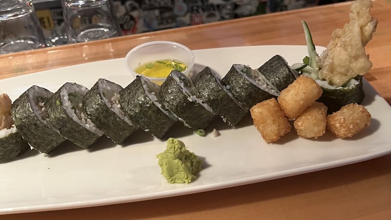 Sticky Rice sushi and Tater Tots together on a platter