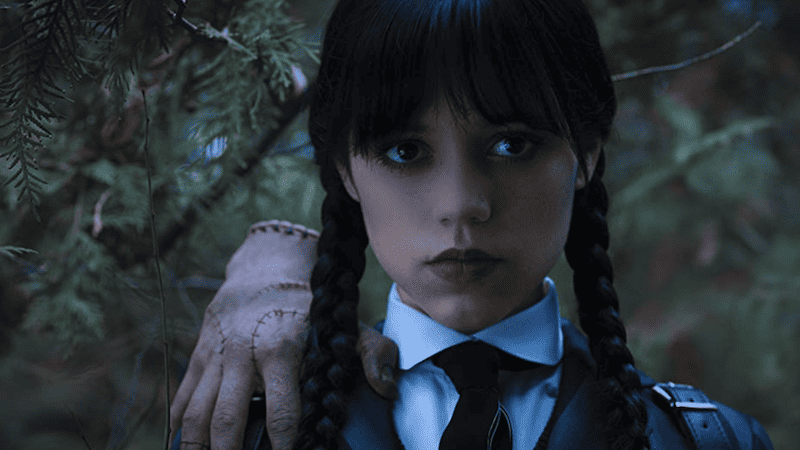 Wednesday Addams and Thing, screenshot from the Netflix TV series, "Wednesday"