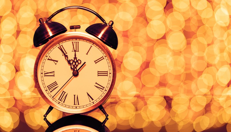 Old alarm clock nearing 12 with lights blurred in the background, marking the countdown to New Year's Eve. More of What’s Booming in Richmond, Virginia, from December 29, 2022 to January 3, 2023: New Year’s Eve, music, event news, and more.