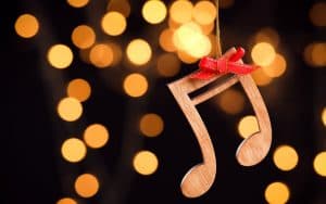 wooden note on background of lights. Image by Chernetskaya. Richmond is serving up book signings and author sightings, Robin and Linda Williams, and holiday tunes. In this week’s “What’s Booming RVA.” Image