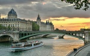 A sunset stroll along the Seine River is one of Paris' most romantic experiences. On a stroll along the Seine River, stirring sensuality and creativity in the shadows of great landmarks, Rick Steves shares love in Paris. Image
