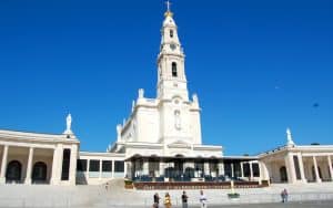 The towering Basilica of Our Lady of FÃ¡tima sits at the head of a vast esplanade. At the top of the steps, a covered open-air altar, cathedra (bishop's chair), and pulpit stand ready to conduct Mass to the thousands of pilgrims who come to celebrate the Virgin of Fatima on the 13th day of each month from May through October. In this humble town, Mary appeared to 3 children then to a crowd of thousands. Rick Steves offers insights for visiting Fatima in Portugal. Image