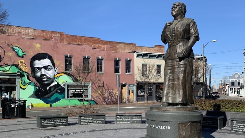 Maggie Walker statue with mural. By Annie Tobey. This week in Richmond, blend contemporary music and humor with insights from Black History Month, in “What’s Booming RVA: Life in America.”