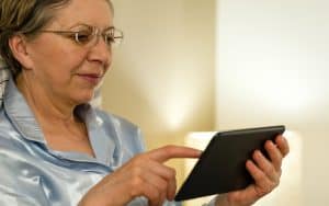 woman using tablet for puzzle. Image by Candybox Images. Exercise your mind with one of America’s favorite puzzles. Fun, stimulating, and picked for baby boomers. Image