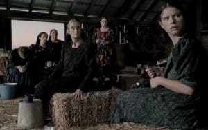 Rooney Mara, left, stars as Ona, Claire Foy as Salome, Judith Ivey as Agata, Sheila McCarthy as Greta, Michelle McLeod as Mejal and Jessie Buckley as Mariche in director Sarah Polley’s film 'Women Talking.' The film “Woman Talking” is based on a novel. When adapting the book, the team made a big shift that changed the emotional tone of the film. Image