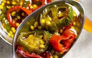 Making candied jalapeños is as easy as heating sliced fresh chiles in a seasoned simple syrup and letting them cool for a versatile topping. The balance of flavors and texture add versatility to these magnificent morsels. Image