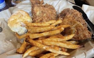 Mama's Chicken Kitchen fried chicken with fries and a biscuit. As part of A geezer's look at Gatlinburg, Tennessee, and two restaurants for grabbing Gatlinburg grub: Mama's Chicken Kitchen and Trish's Mountain Diner. Image