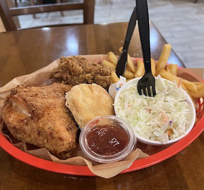 Fried chicken meal, with Cole slaw, biscuit, and fries, at Mama's Chicken Kitchen for great Gatlinburg grub