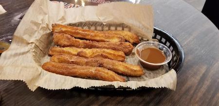 Churros with a dulce de leche dipping sauce