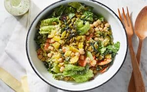 Cilantro adds color and flavor when blended to make a creamy dressing for this hearty Chopped Power Salad. Enjoy it for lunch or dinner year round. Image