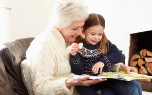 grandmother and granddaughter playing with sticker book. Parents know that they will face the proverbial empty nest when their children leave home, but Laurie Whitman experienced a second empty nest. She shares with Boomer readers her experience after her first granddaughter went to kindergarten. Image