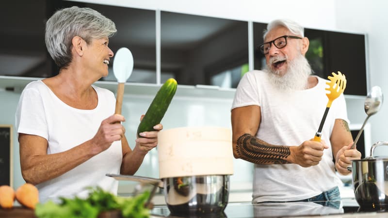 man and woman in kitchen laughing, by Alessandro Biascioli. Comfortable Home Remodeling Tips for Aging-in-Place