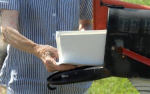 elderly woman at mailbox, by Bonita Cheshier. Boomer reader Doreen Mary Frick shares a snapshot of her elderly neighbor Alice, and the connections that add meaning to her days. Image