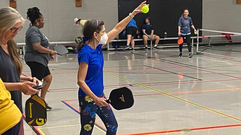 Mary Jo Panettieri serves up a pickleball at Tarboro Road Community Center in Raleigh. (Josh Shaffer/The News & Observer/TNS). A reporter from Raleigh, North Carolina, catches up with a couple from Connecticut who are on a mission to play pickleball in all 50 states. Image