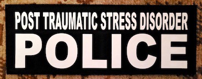 Sign saying "Post Traumatic Stress Disorder: Police"