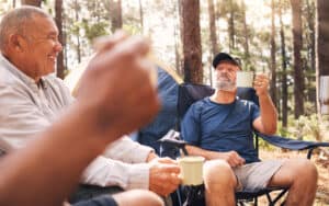 senior men at a campsite drinking coffee before a hike. Image by Yuri Arcurs. Should you combine coffee and exercise? If so, when and how? Betty Gold of RealSimple examines the connection. Image