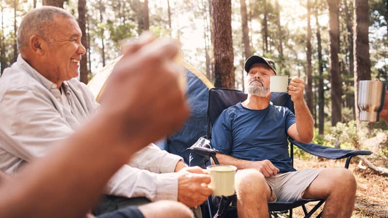 senior men at a campsite drinking coffee before a hike. Image by Yuri Arcurs. Should you combine coffee and exercise? If so, when and how? Betty Gold of RealSimple examines the connection. Image