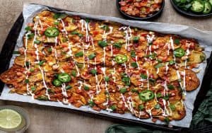 The heartiest hybrids on the pub scene, Irish Nachos, were invented in 1980 at J. Gilligan’s Bar and Grill in Arlington, Texas. Thin-sliced potatoes are roasted until crisp then topped with all your favorite nacho toppings in this comfort food twist. Image