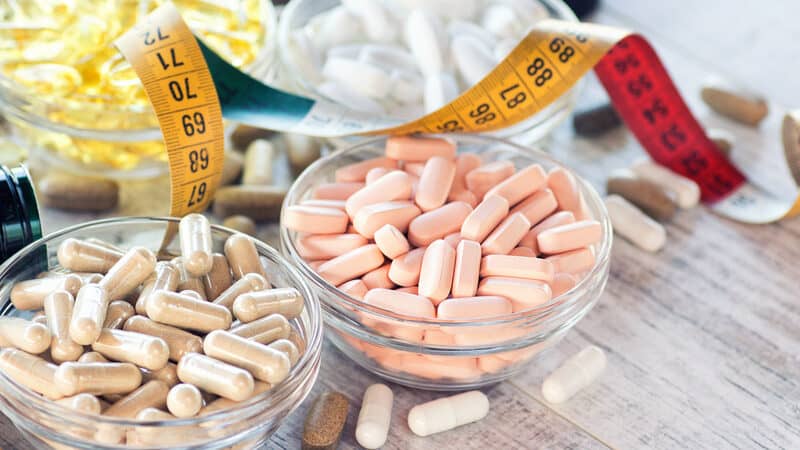 dietary supplements and a tape measure. Will taking a probiotic supplement help you lose weight? Mayo Clinic weighs in on the probiotics and weight loss connection – and if there is one. Image