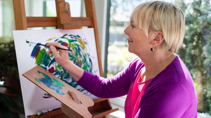 woman painting at home. Image by Diego Vito Cervo. After two comfortable years of keeping to herself, this introvert ponders the pandemic changes she sees in herself, including a lower tolerance level. Is her reaction normal? She what advice columnist Amy Dickinson says in this edition of “Ask Amy.” Image