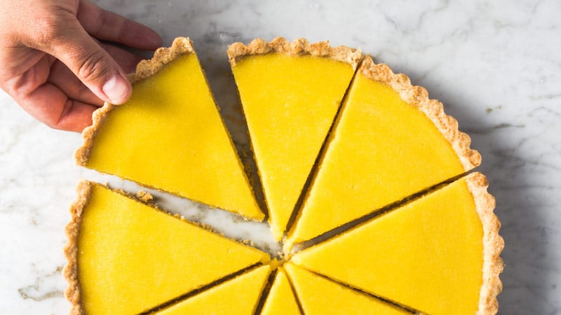 The bright citrusy taste and vibrant yellow color make the Lemon Olive Oil Tart perfect for a warm weather splurge!
