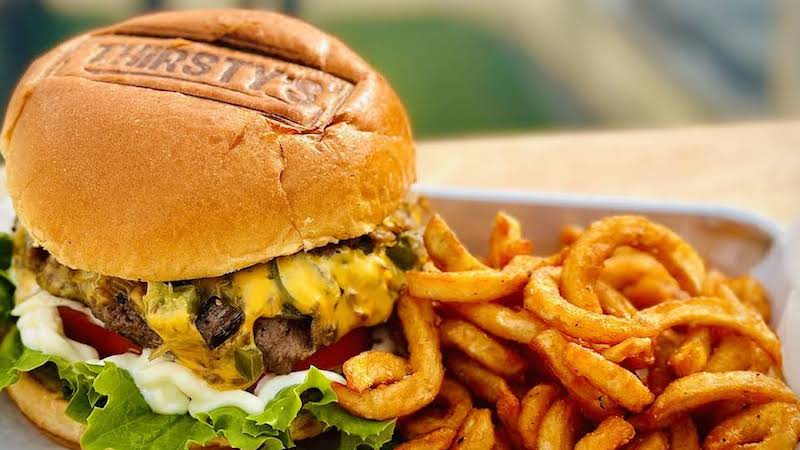 A burger with curly fries from Thirsty's at Massanutten, for article on finding fun and food in Massanutten