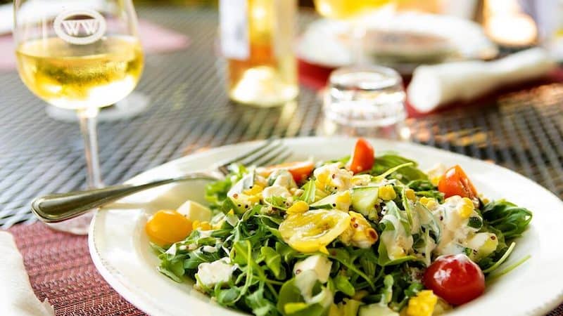 Corn and cucumber salad at the Gabriel Archer Tavern July 19, 2022. Baby arugula, heirloom tomatoes, quinoa, crumbled feta cheese with a basil dressing. For article on the Virginia Peninsula Wine Trail and AVA.