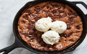 Skillet Brownies make the ultimate dessert even better: gooey in the center, crisp around the edge, with brown butter for rich caramel notes. Image