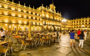 Though details have changed, locals still gather and flirt in Plaza Mayor in Salamanca, Spain. Travel writer Rick Steves tells us of this and other masterpieces in the Spanish town. Image by Olivier Guiberteau Image