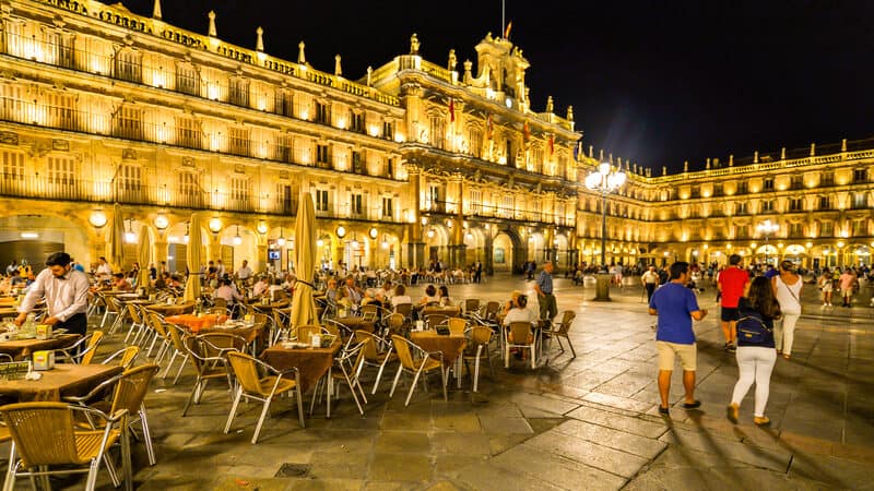 Though details have changed, locals still gather and flirt in Plaza Mayor in Salamanca, Spain. Travel writer Rick Steves tells us of this and other masterpieces in the Spanish town. Image by Olivier Guiberteau Image