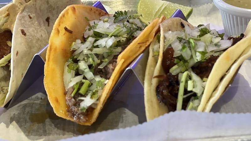 Closeup of three tacos. Life-changing tacos? That’s what food writer Steve Cook claims to have found at Lalo’s Pinches Tacos Bar and Grill in Richmond, Virginia.