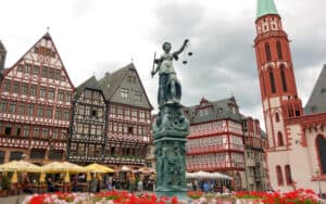 Frankfurt's Romerberg Square looks old, but the half-timbered buildings were rebuilt in 1983, four decades after bombs destroyed the originals during World War II. “For years, Frankfurt was a city to avoid … but today, its energy makes it worth a look,” says travel writer Rick Steves, sharing highlights of what makes a visit to modern Germany in Frankfurt worthwhile. Image