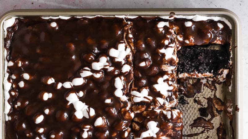 Mississippi Mud Cake uses chocolate and marshmallows generously for a rich, gooey treat that blends these two divinely paired ingredients..