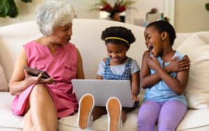 Grandma and two grandkids on a laptop, from Wavebreakmedia. Two Jumble puzzles, with ghostly math: play one with your favorite kid or use it as a warm-up, then tackle the more challenging puzzle. Image