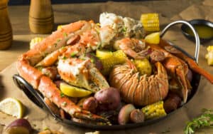 Celebrate the summer with good friends and a delicious seafood boil. This recipe from a Louisiana sous chef makes it easy. Image by Bhofact2 Image