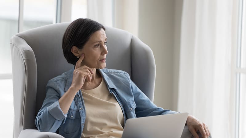 A middle-aged woman looking pensively to the side. Image by Fizkes. Signs of autism in women are different. A woman wants to share this with her sister and mother, who may be autistic. "Ask Amy" weighs in.