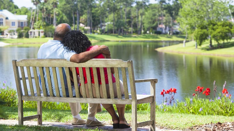 senior couple sitting on a bench. What’s the magic formula for post-divorce dating after 50? How can you know if it’s time – or if will ever be time? Experts weigh in.
