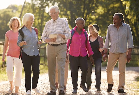 a group of older adults hiking, from Monkey Business Images - a better way to date