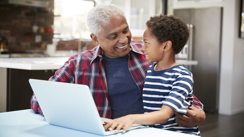 African American granddad and grandson on a laptop together. From Monkey Business Images. For Jumble for Kids and Adults: Shapes and Riddle puzzle